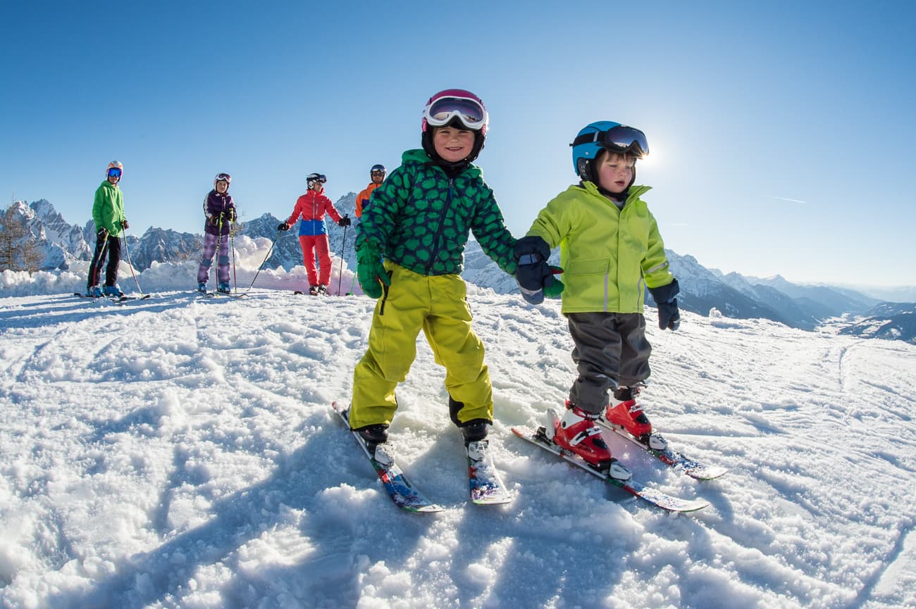 Children learning how to ski